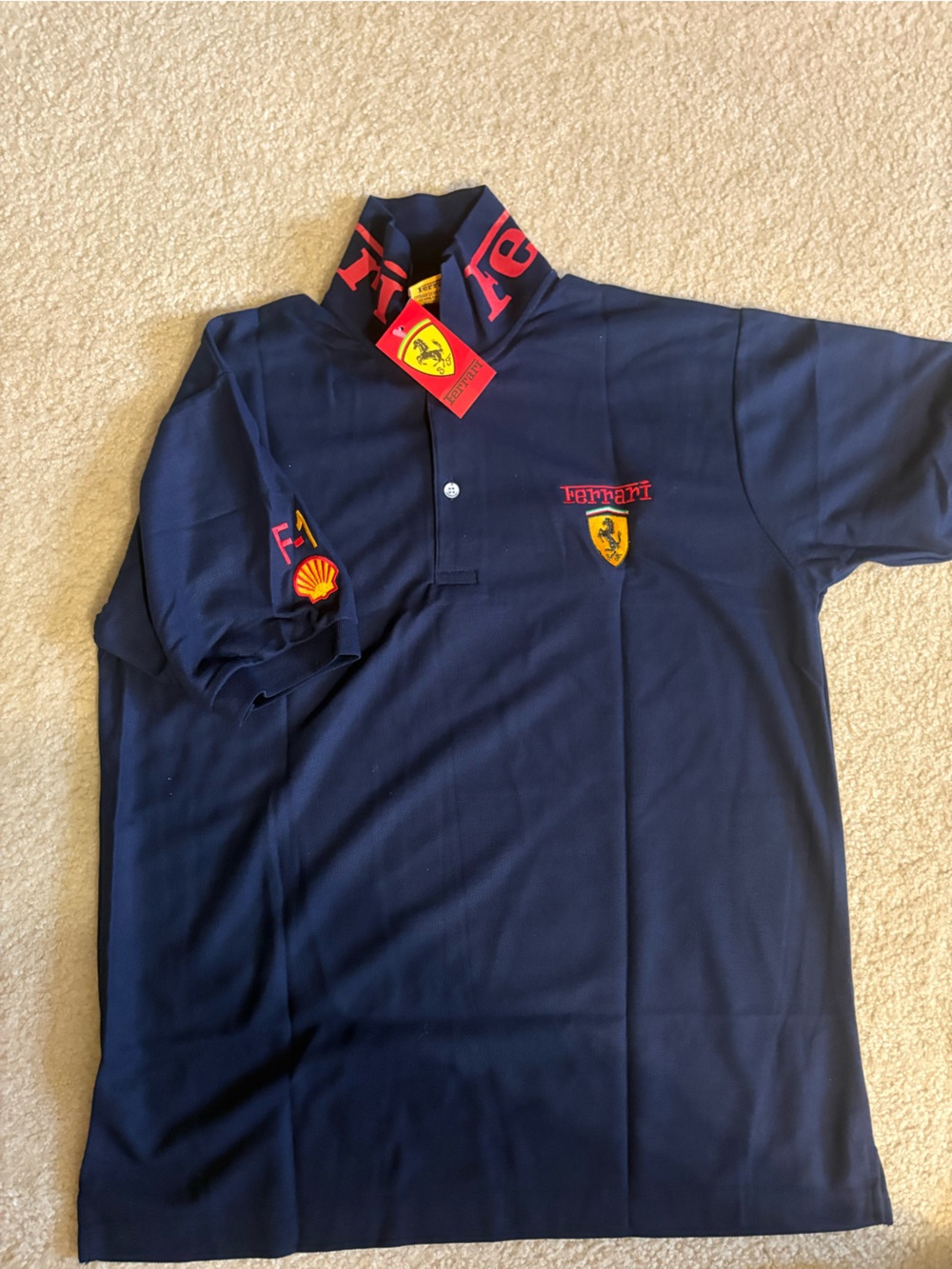 New with tag (sz XL FIT L )Ferrari Navy Polo with Yellow Shield and Red Accents